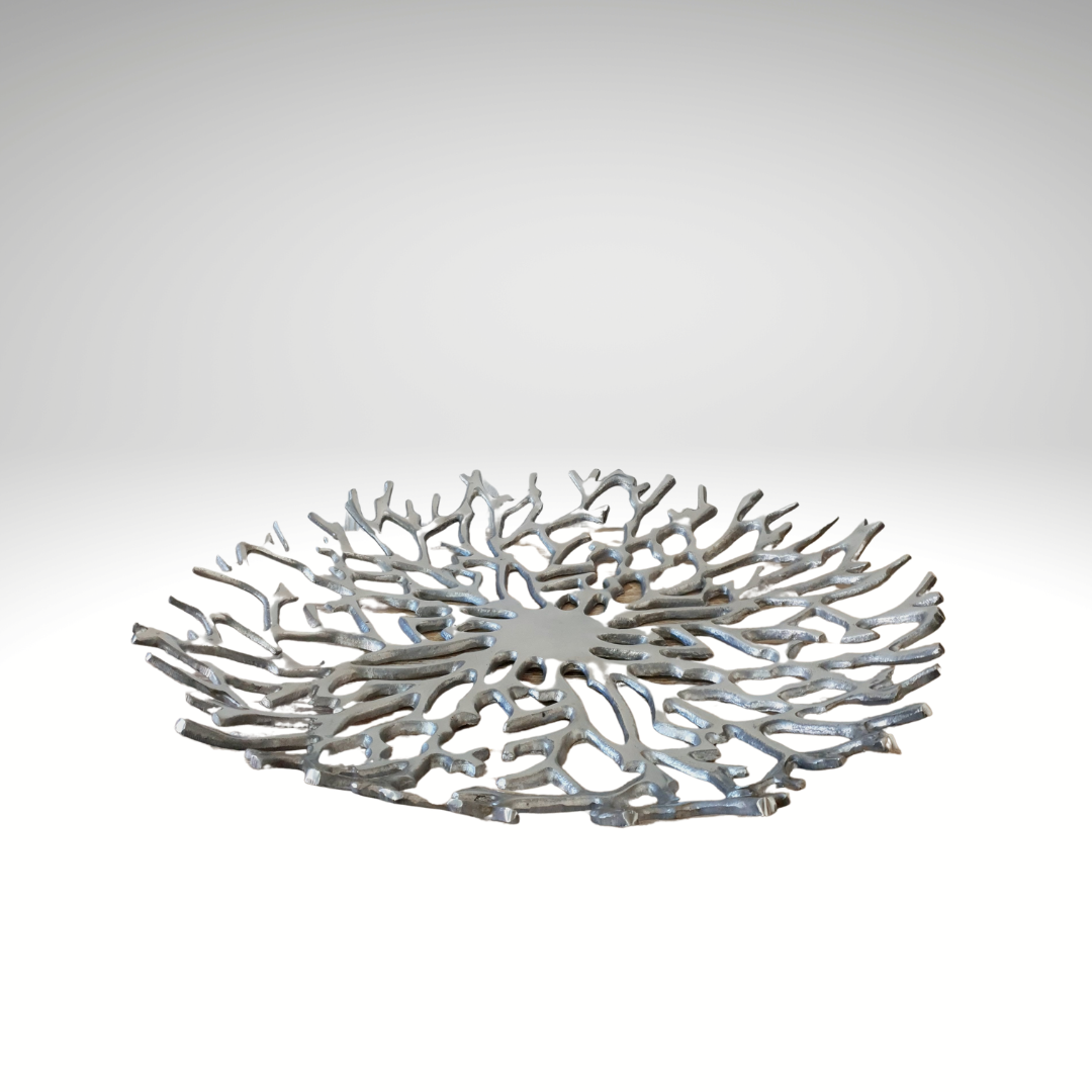 steel round bowl on a white wall 
