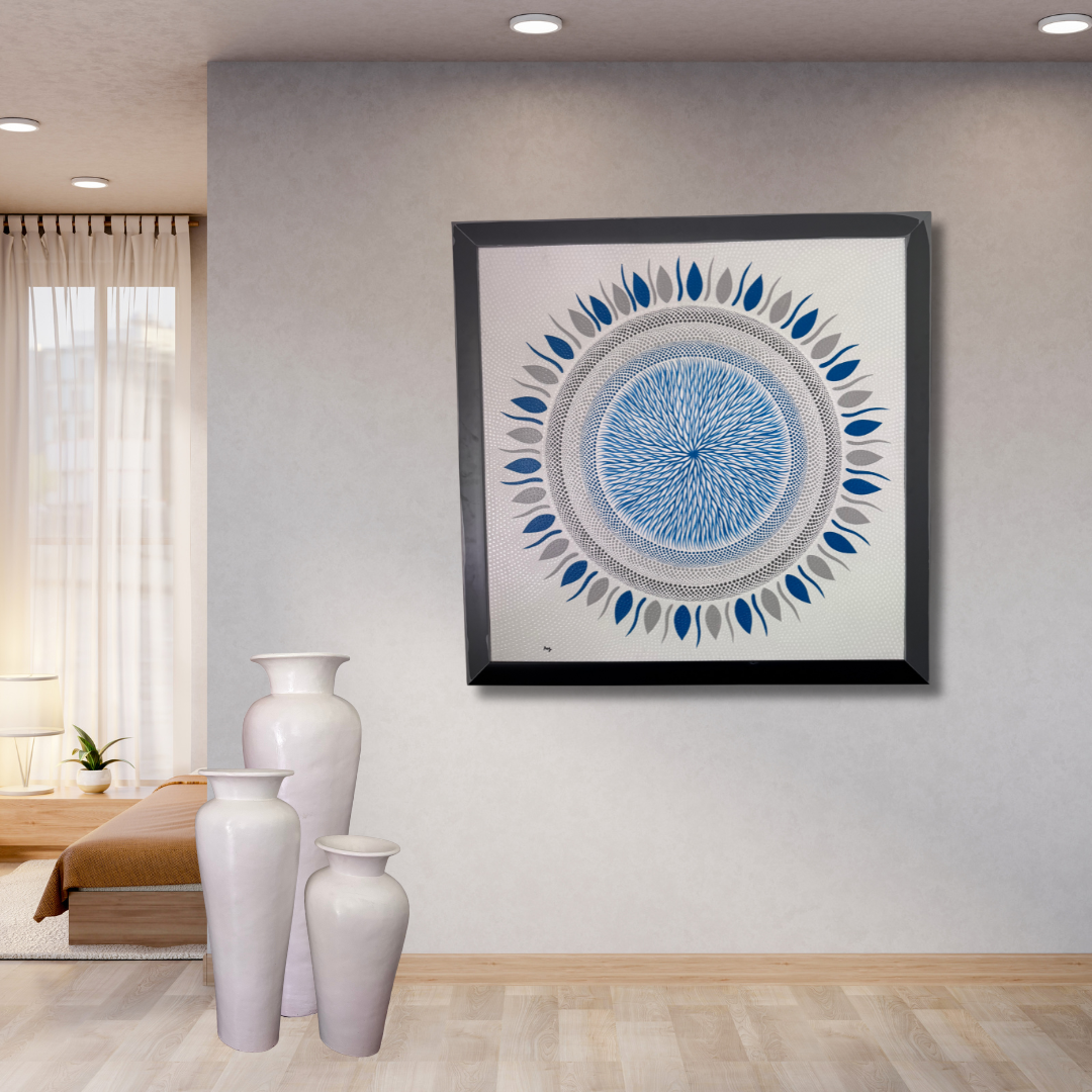 Framed abstract art piece on a wall with white vases below in a room setting.