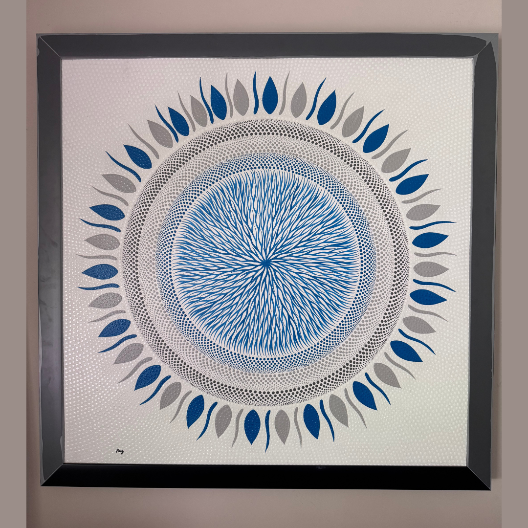 Framed artwork with a blue and gray circular design on a beige background