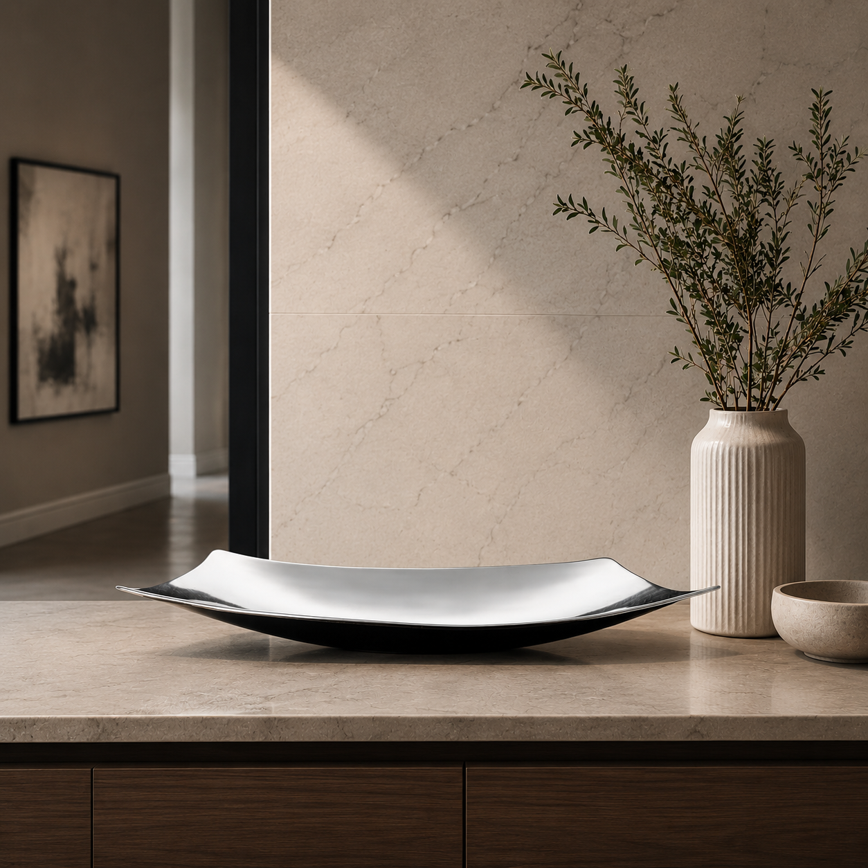 Curved tray on marble bench styled with ceramic vase and greenery
