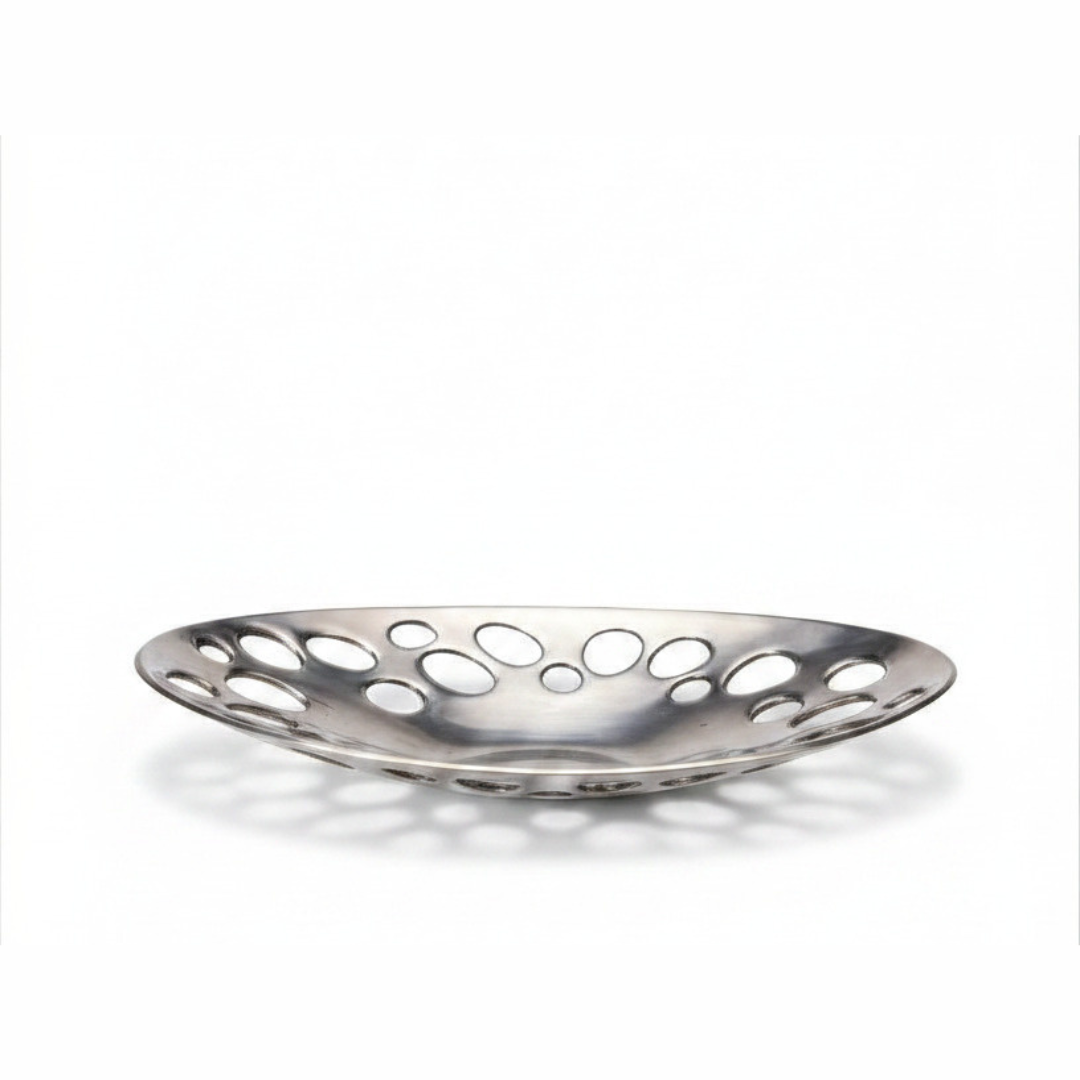 Oval bowl photographed from above on white background showing cutout pattern