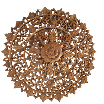 A Balinese carved wall art panel featuring a floral design, made from suar wood.