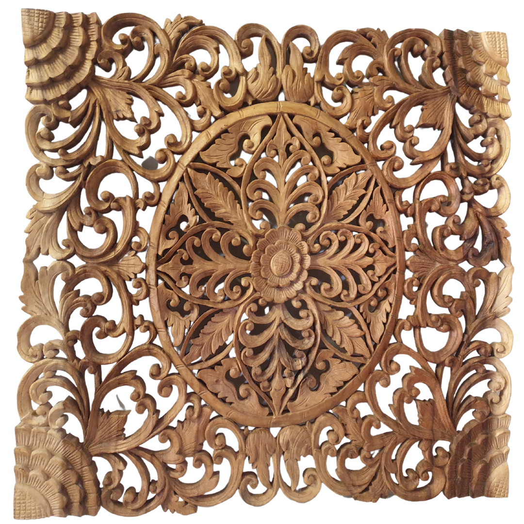 A Balinese carved wall art panel featuring a floral design, made from suar wood.