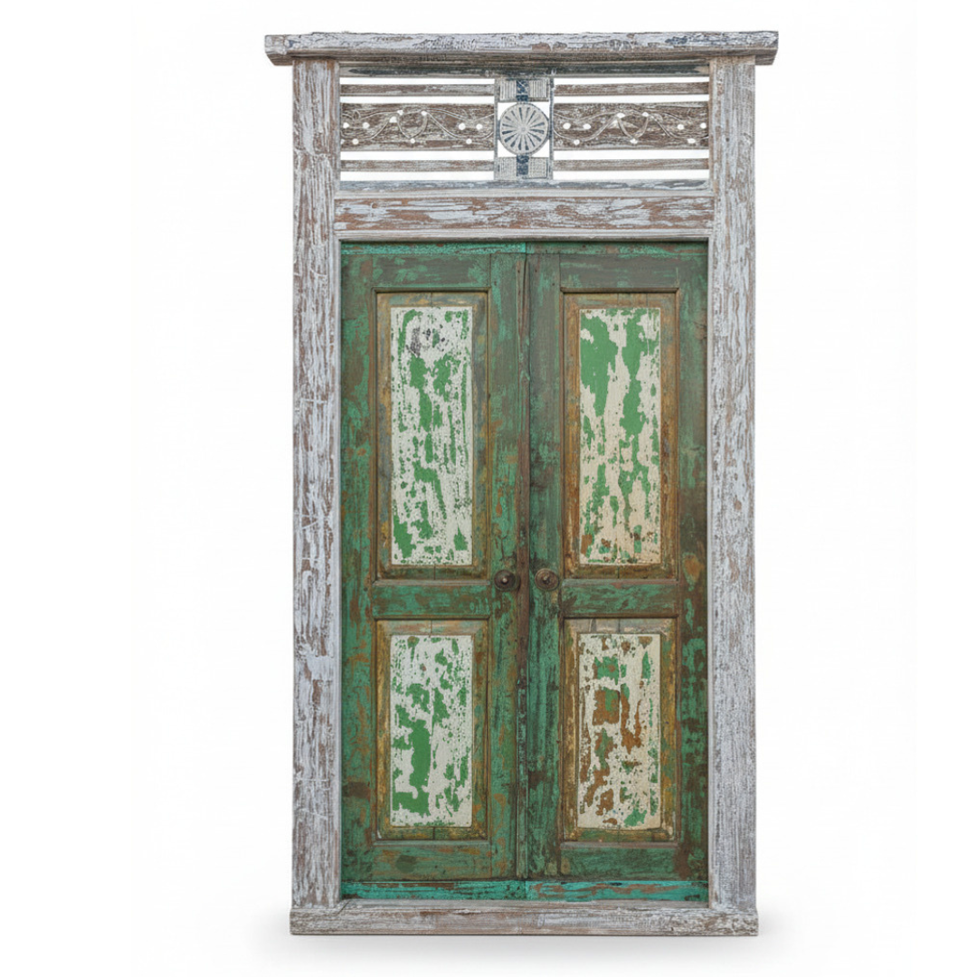 Vintage wooden door with peeling green paint on a white background