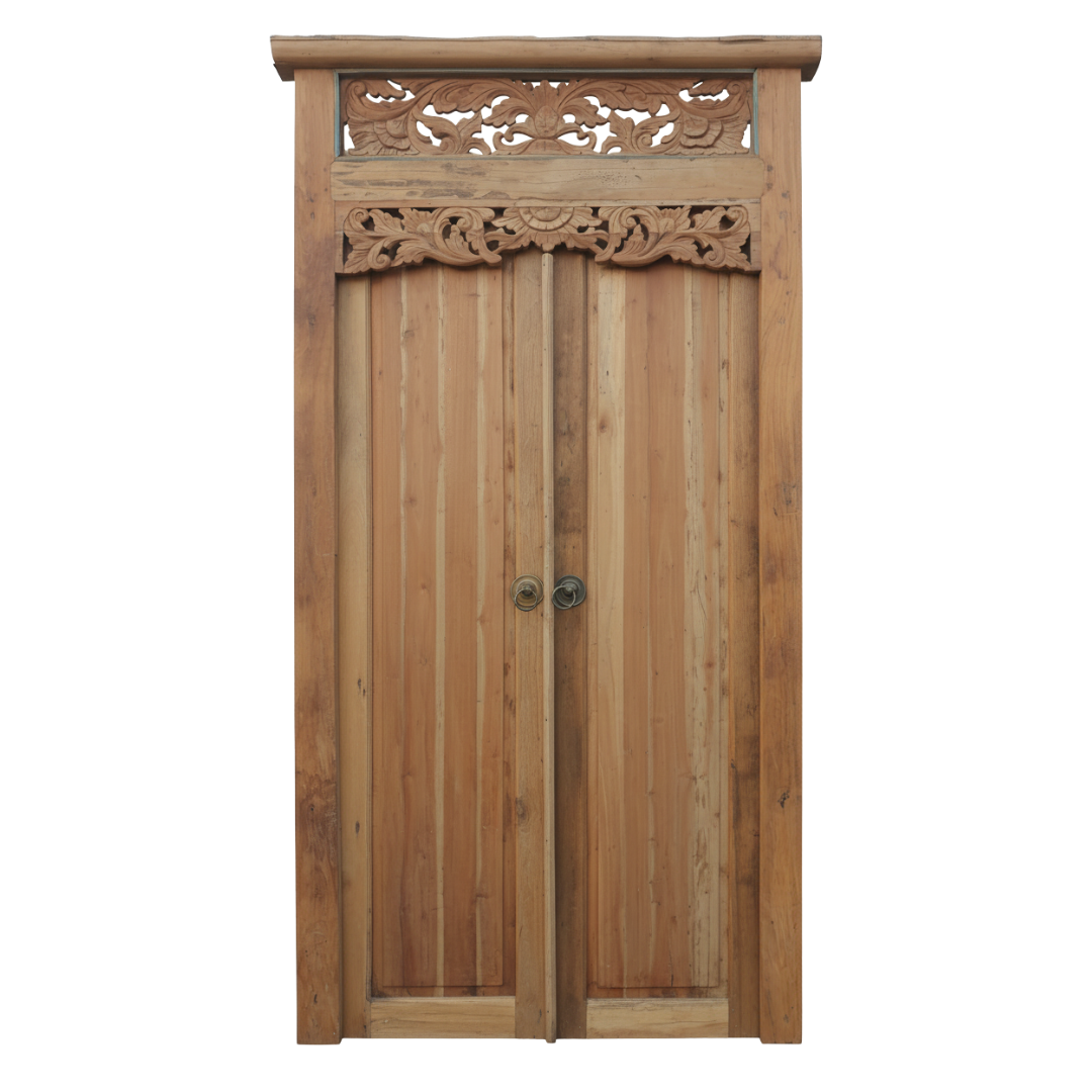 Balinese reclaimed timber double door with hand-carved floral frieze, lattice transom and brass ring handles on white background