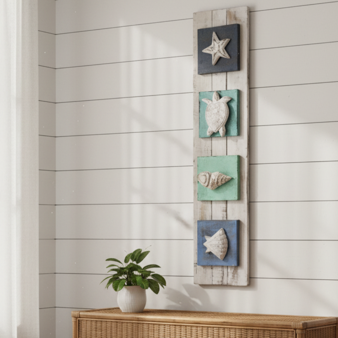 Close up view Handmade timber art panel with raised shell and turtle carvings hung on a shiplap wall above a wicker sideboard