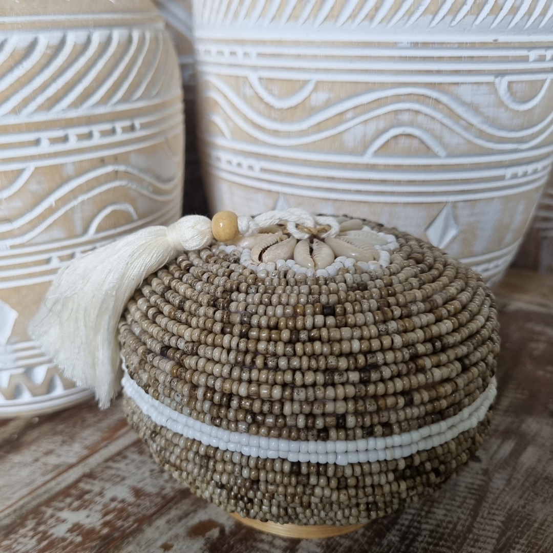 Beige Beaded Bamboo Trinket Box styled on bed with coastal home decor | Azure Decor