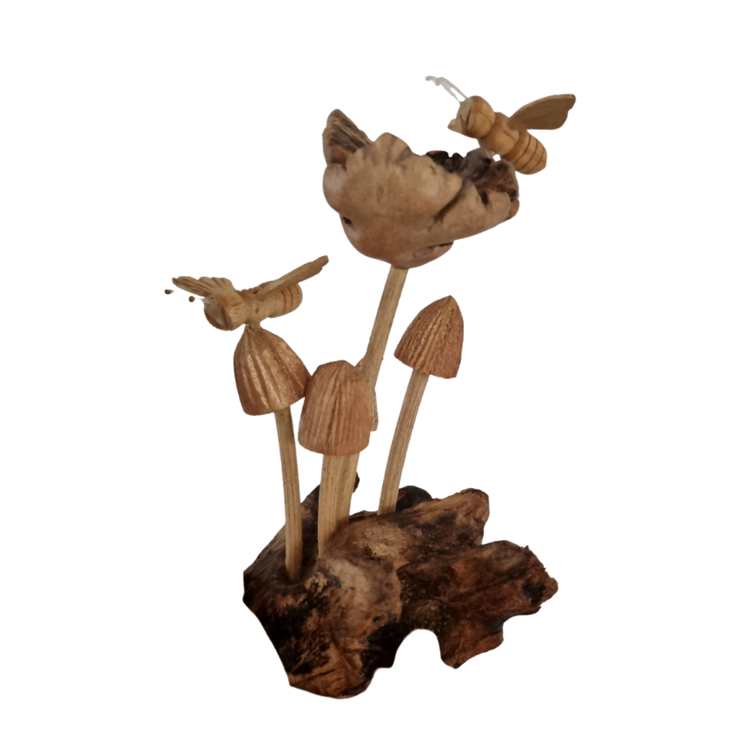 Cluster of hand-carved mushrooms with two wooden bees on a gnarled parasite wood root base, white background