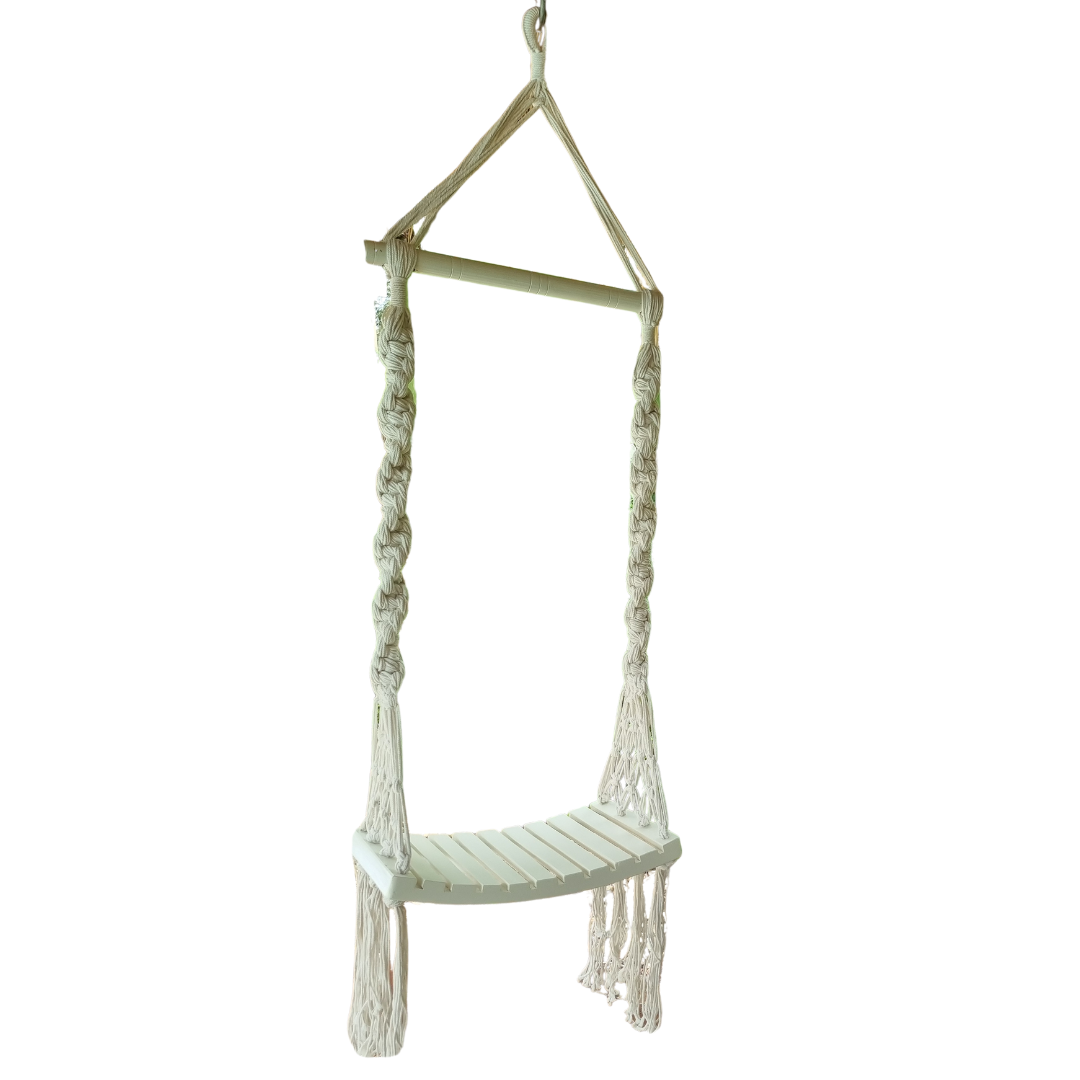 Swing with a solid wooden seat, designed with intricate patterns and tassels.
