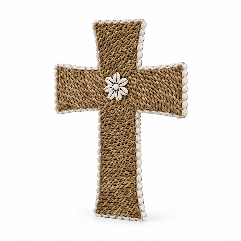 Angled view of a natural rope cross with white shell edging and a shell flower at the centre against a white background
