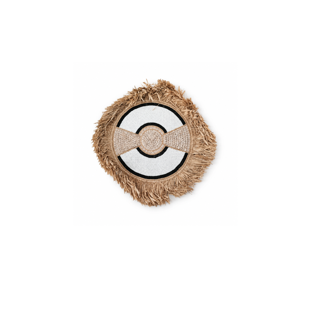 beaded shell and seagrass wall art on a white back ground with two black rims