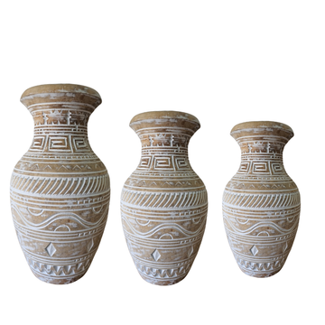 Three decorative vases with geometric patterns on a white background
