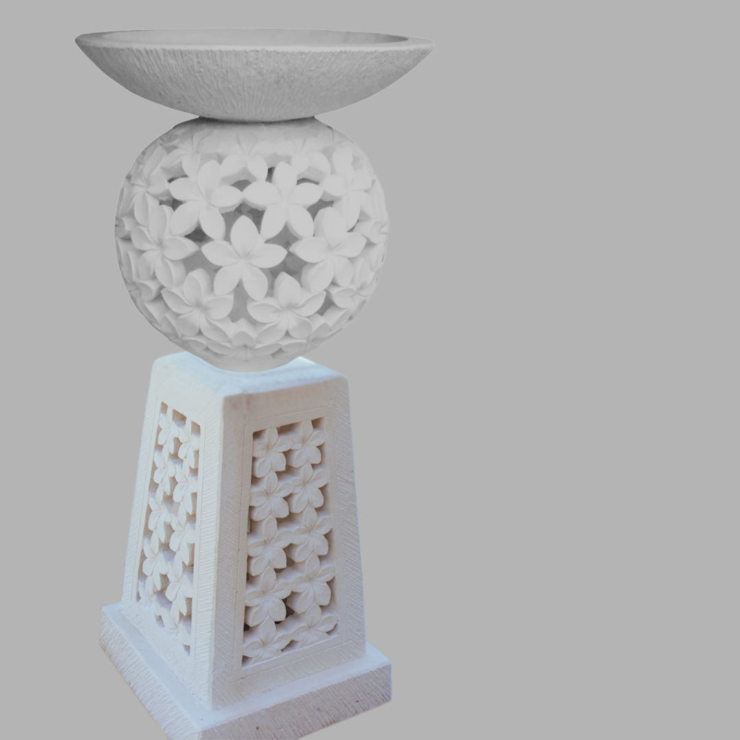Decorative white stone lantern with intricate carvings on a gray background