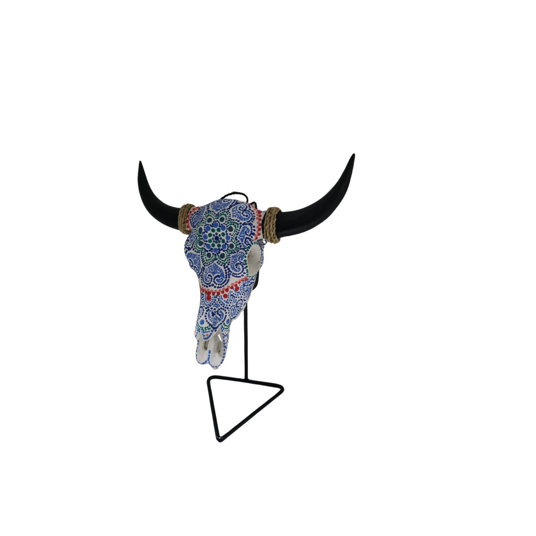 Azure Mandala Bull Skull – hand-painted resin bull skull with intricate blue mandala pattern on black metal triangle stand, white background