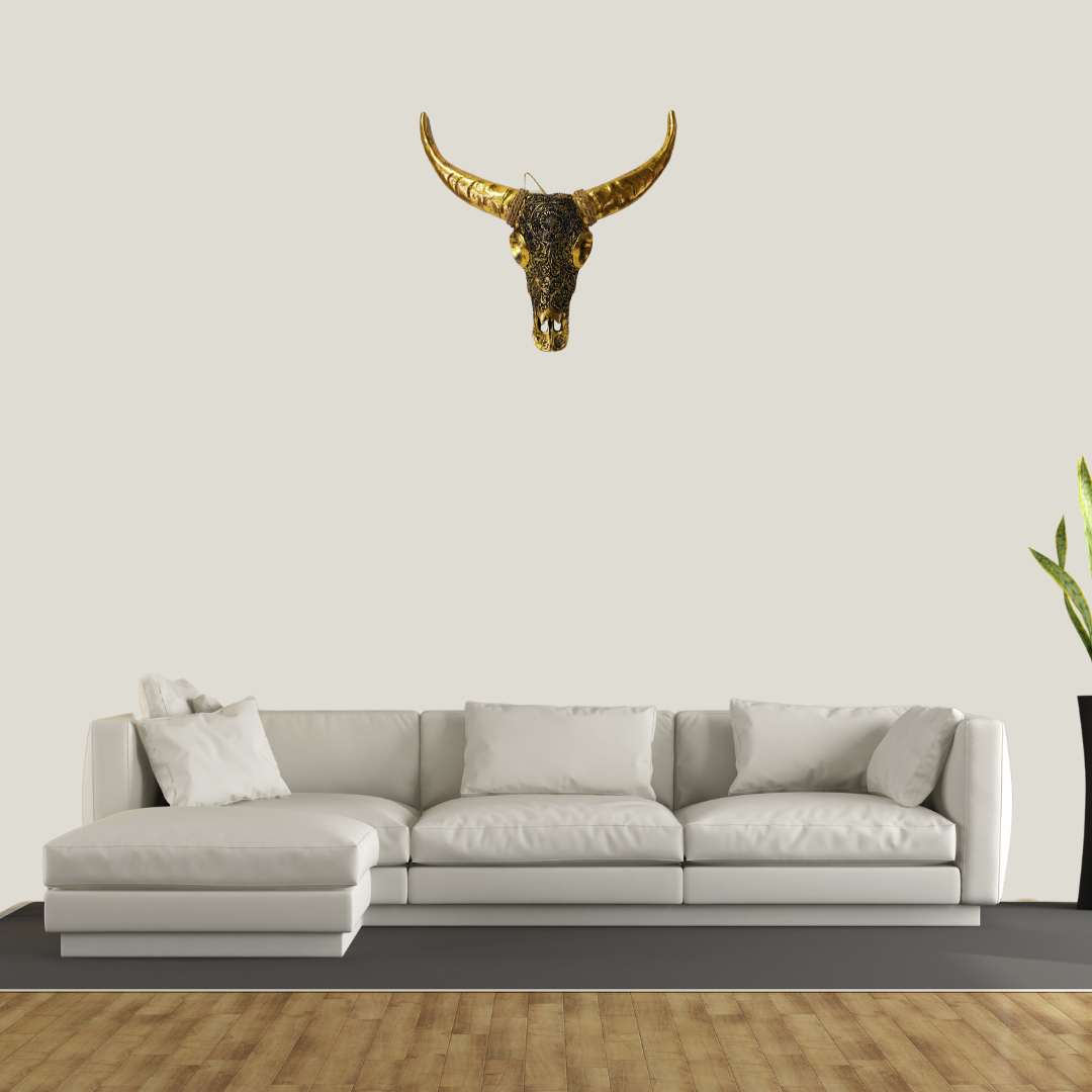 STYLE 1 GOLD SKULL ON LIVING ROOM WALL SOUNDED BY GRAY AND WHITE TONES.Skull Rustic Gold