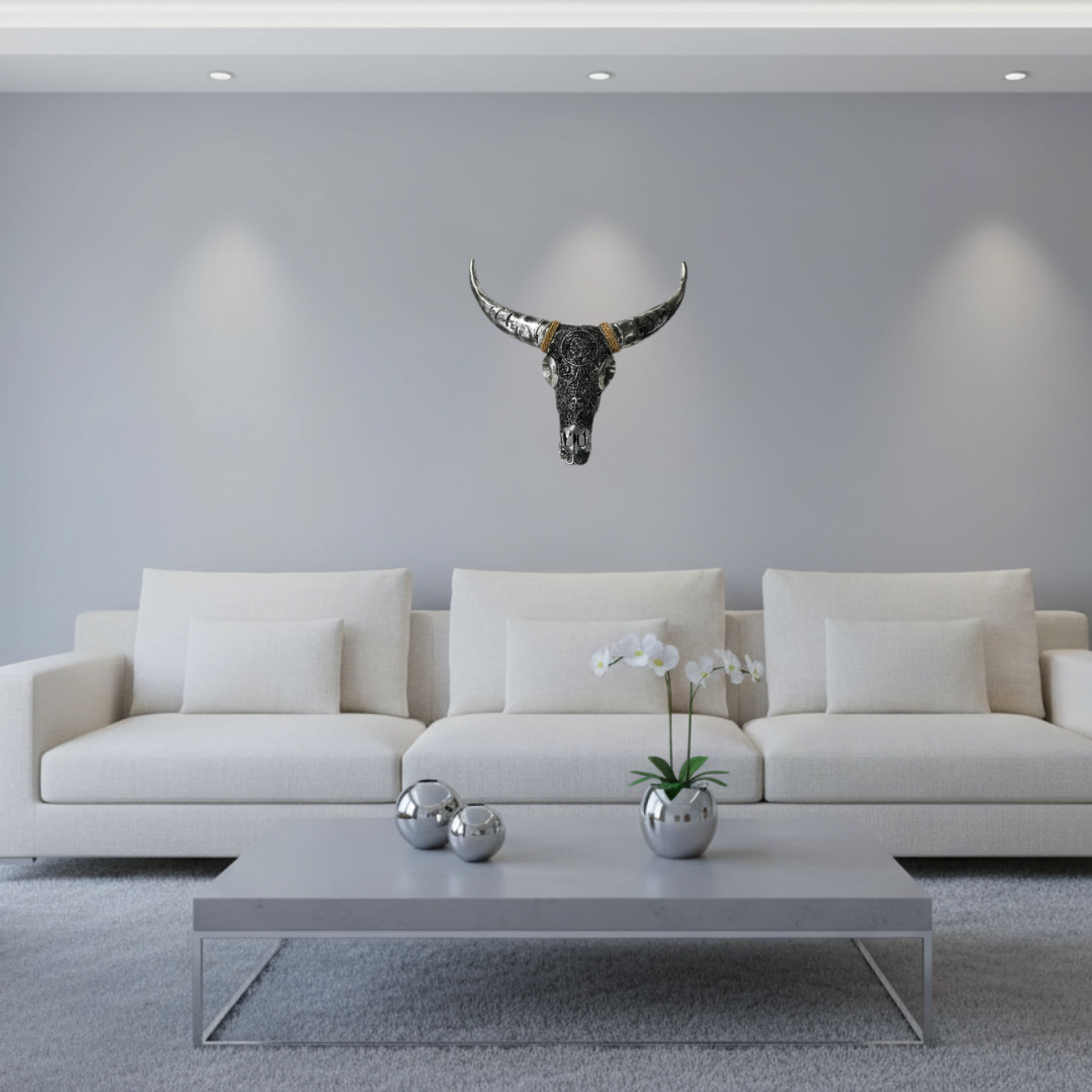 Handcrafted metallic silver bull skull wall art with intricate mandala engraving, styled on a light grey wall in a sleek contemporary living room with linen sofa and cool ambient lighting — Azure Decor Australia