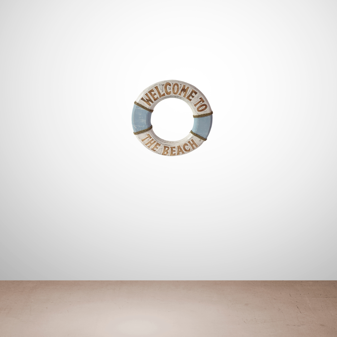 Decorative wreath with 'Welcome to the Beach' text on a white wall.