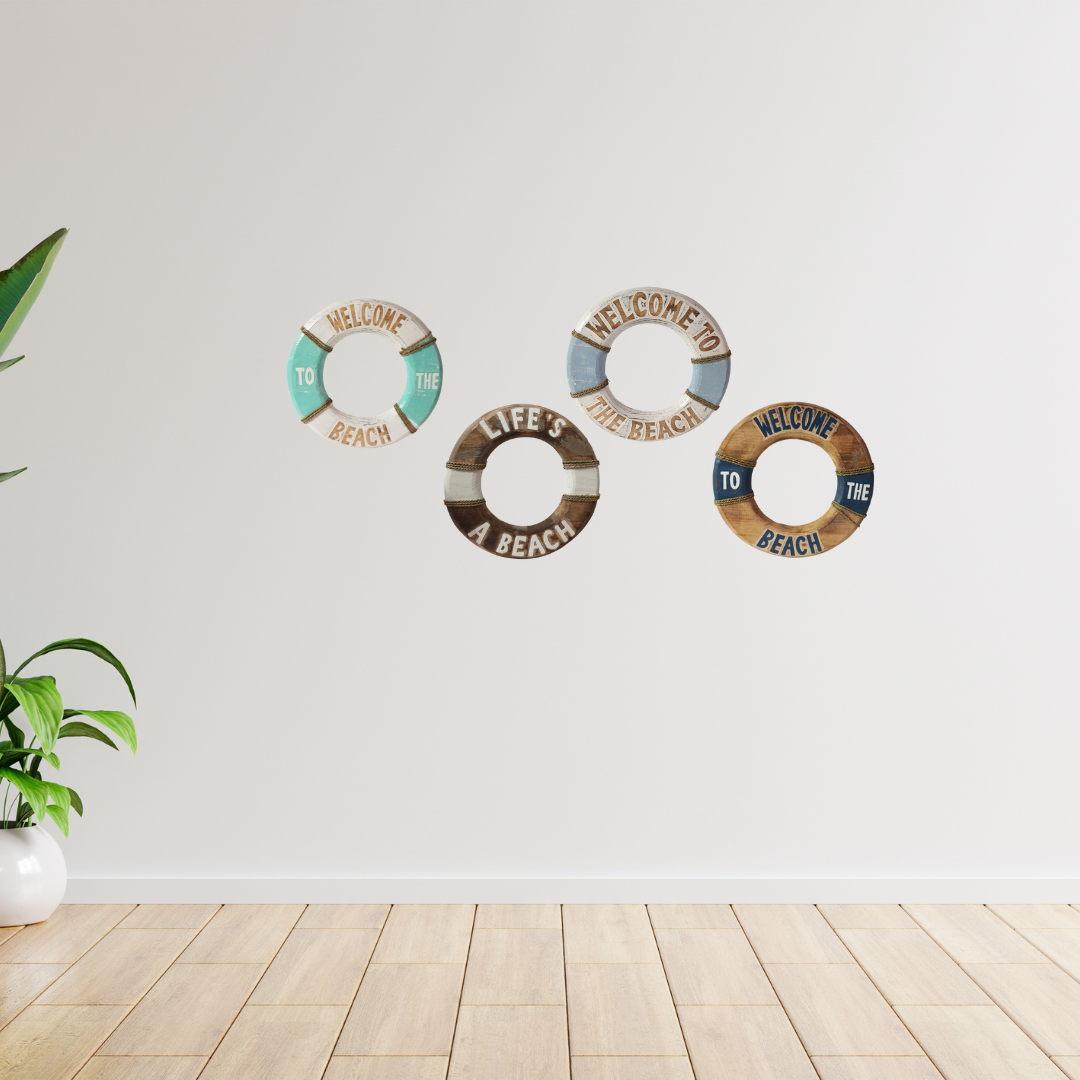 Three decorative wall signs with beach-themed text on a white wall.