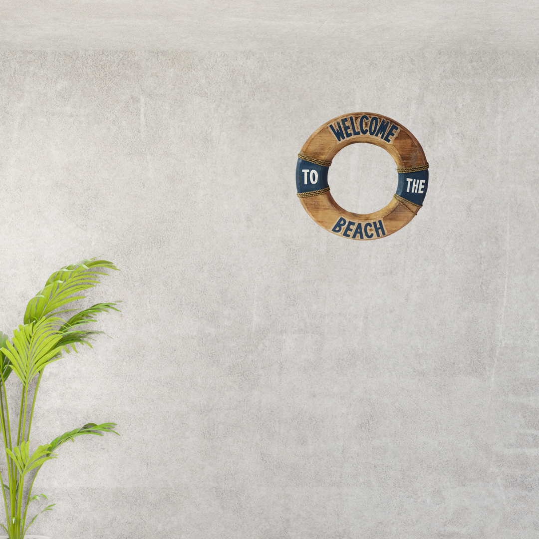 Decorative life buoy with 'Welcome to the Beach' text on a textured wall.