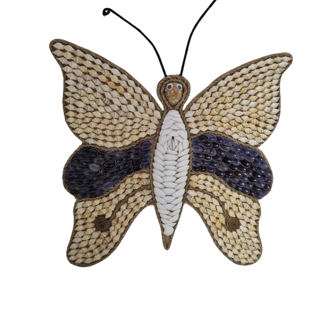 A closeup of a wall-mounted Butterfly Shell Artwork made from assorted shells, predominantly in shades of brown and white, with a butterfly silhouette in the center.