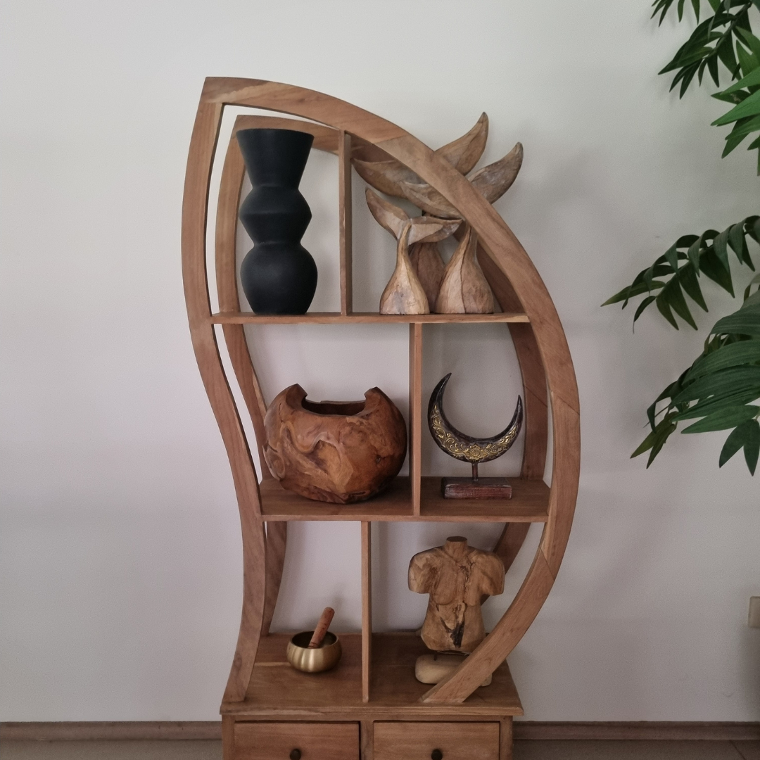 Wooden shelf with decorative items against a white wall