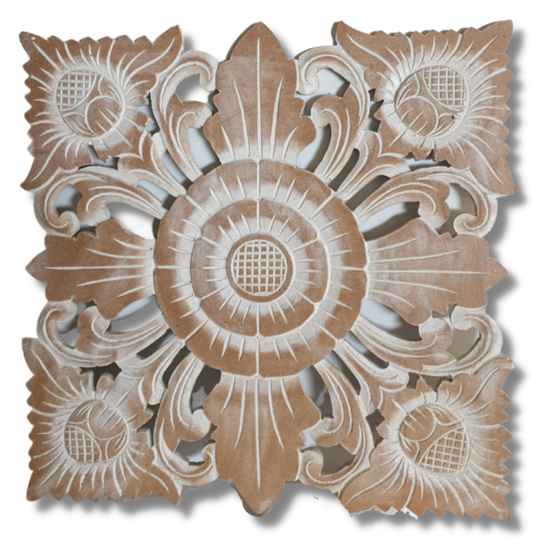 Decorative wooden panel with intricate carvings on a white background
