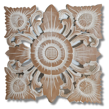 Decorative wooden panel with intricate carvings on a white background