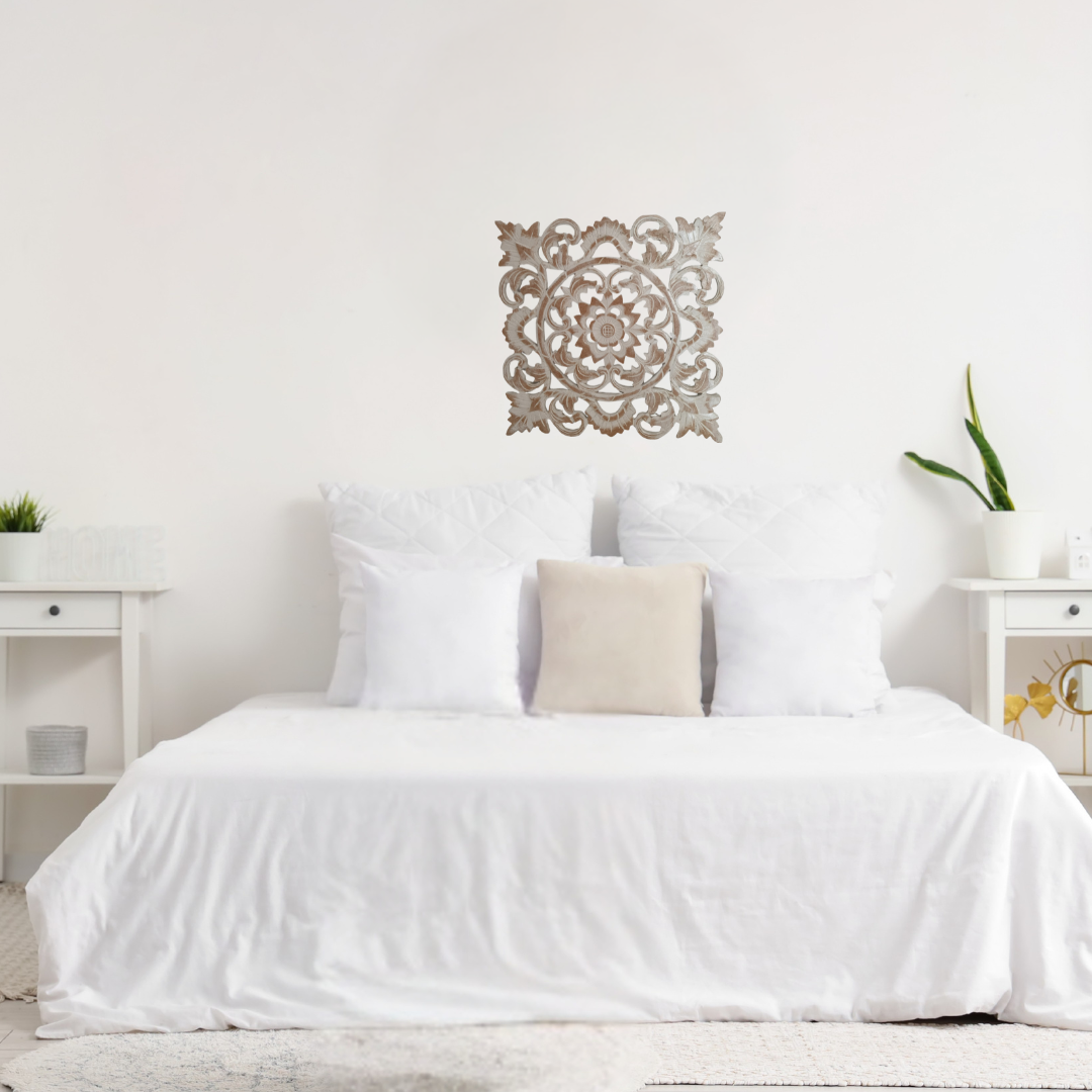 Decorative wall art above a bed in a bedroom setting