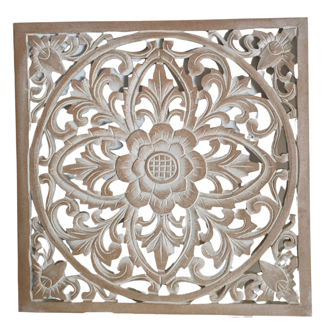 Decorative wooden panel with intricate carvings on a white background