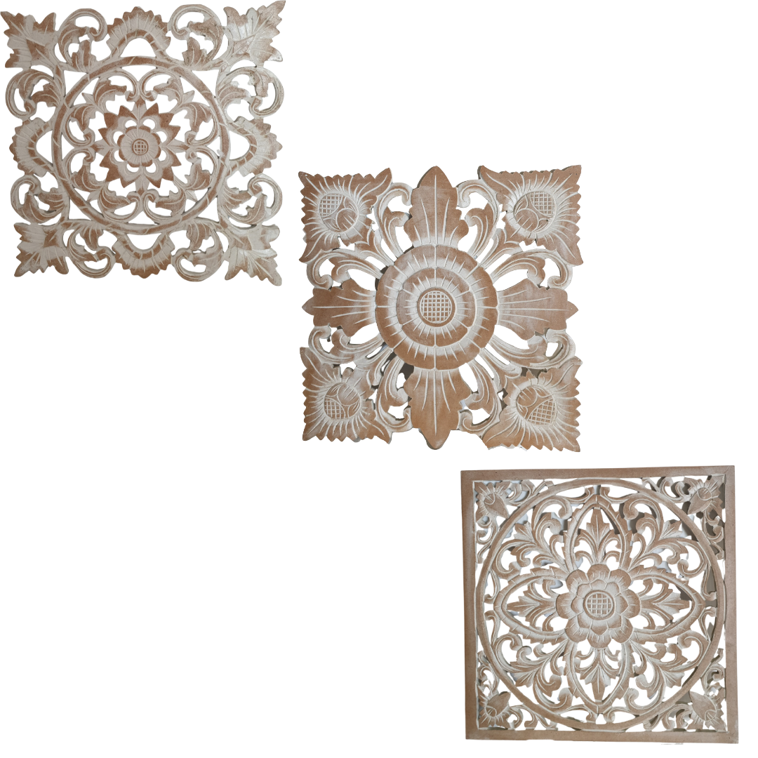 Three decorative wooden panels with intricate carvings on a white background