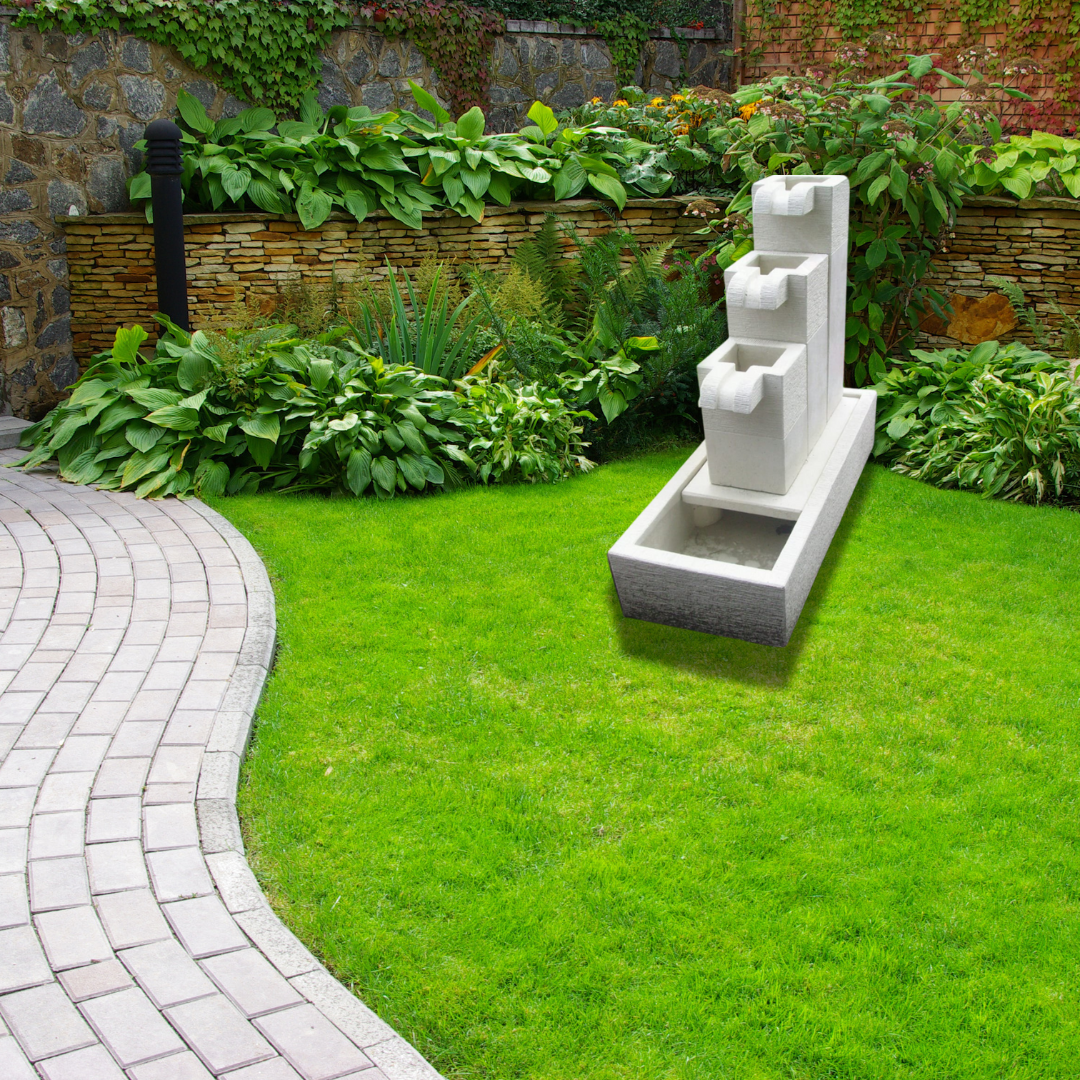 Garden scene with a stone pathway, grass, and a decorative water fountain.