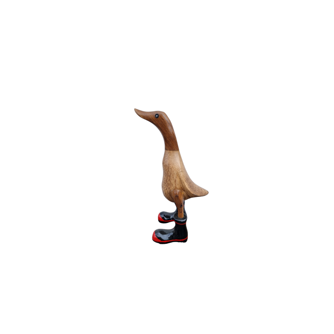 natural figurine with black gumboots on white background