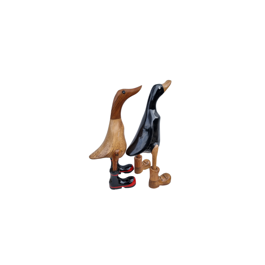 wooden figurines set on a white back ground natural boots and gumoots style 