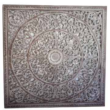 Decorative wall panel with intricate carvings on a white background