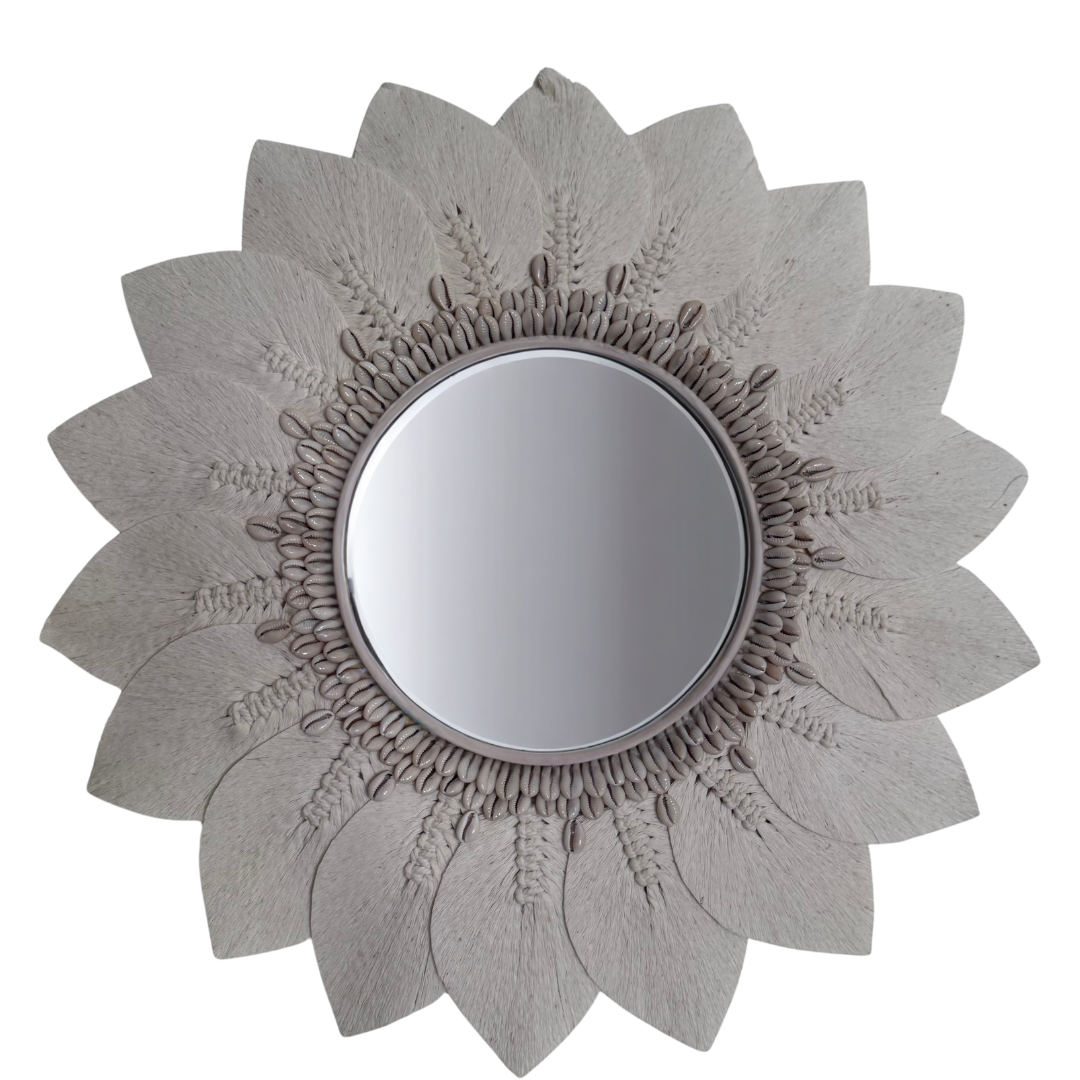 Decorative wall mirror with a sunflower design on a white background