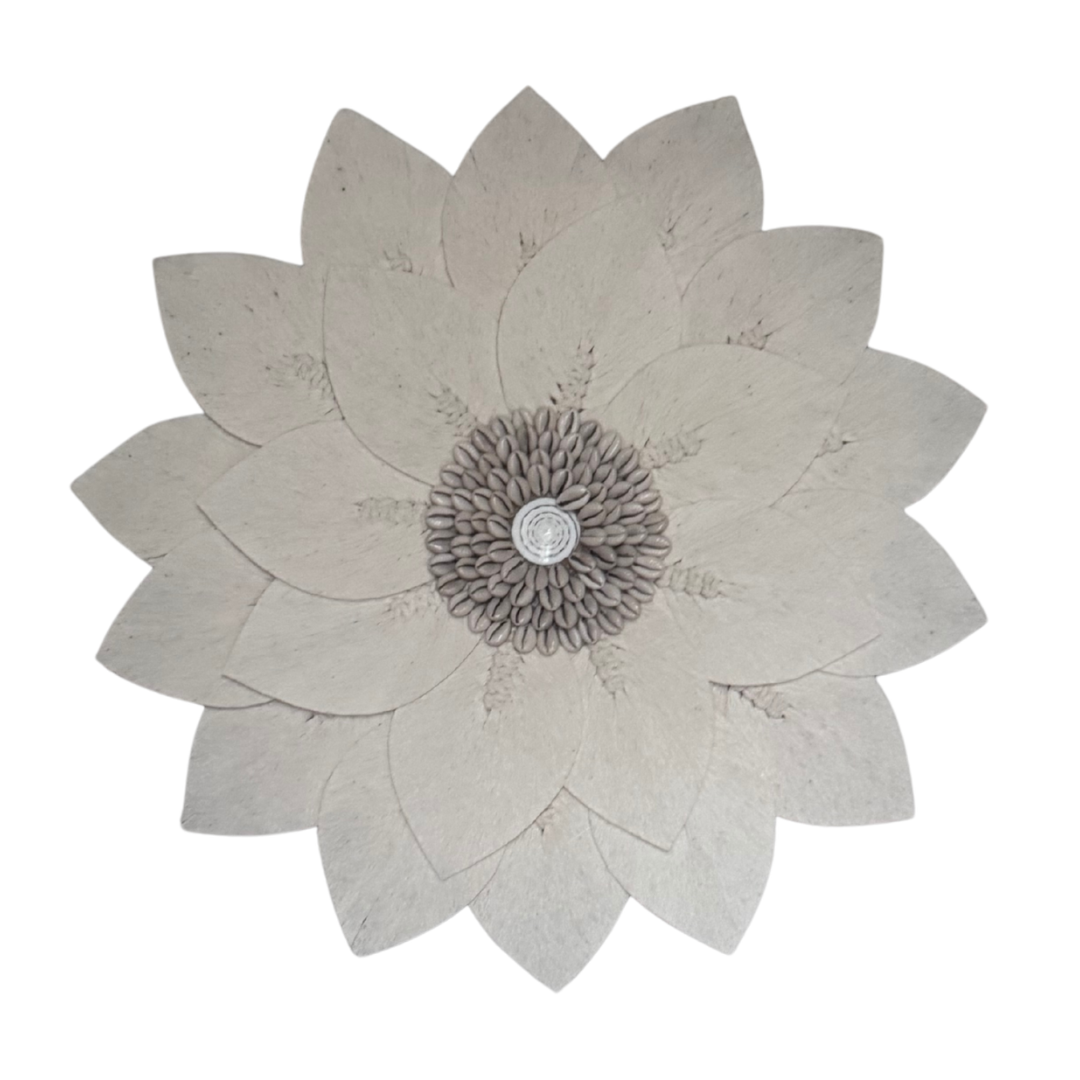 Decorative wall art with a flower design on a white background