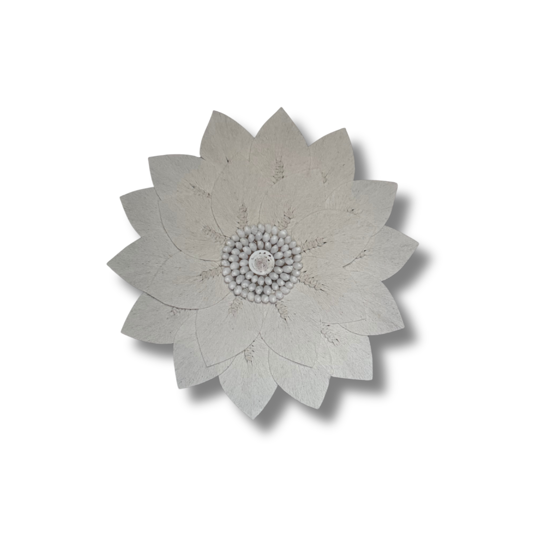 Decorative wall piece with a floral design on a white background