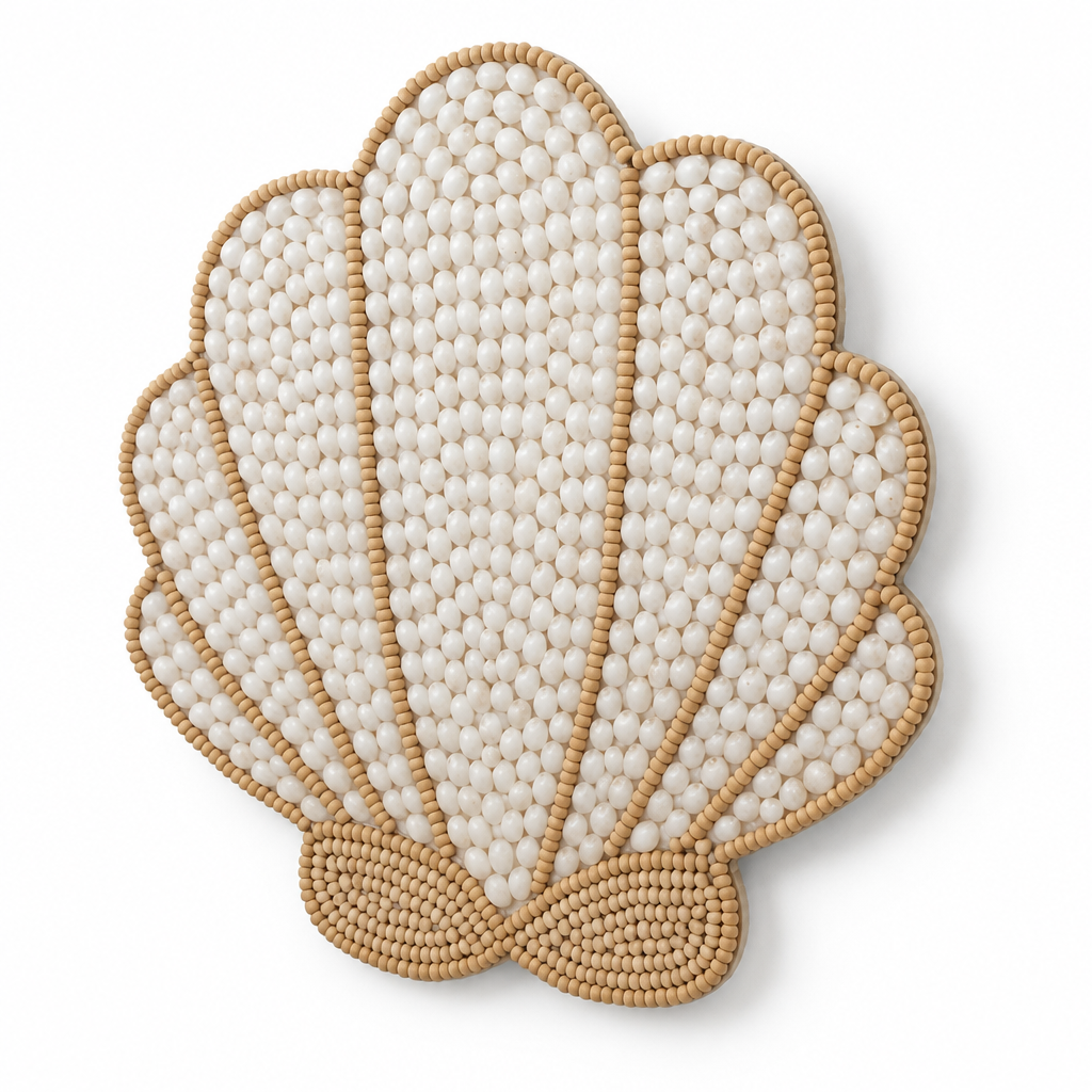 Angled view of a scalloped decoration showing raised ivory mosaic pieces, tan bead edging and a slim profile