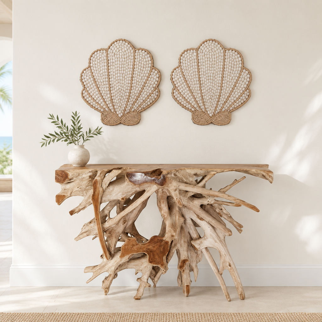 coastal style wall shell art work Two matching fan-shaped decorations above a branching teak root console, styled with a ceramic vase and leafy stems