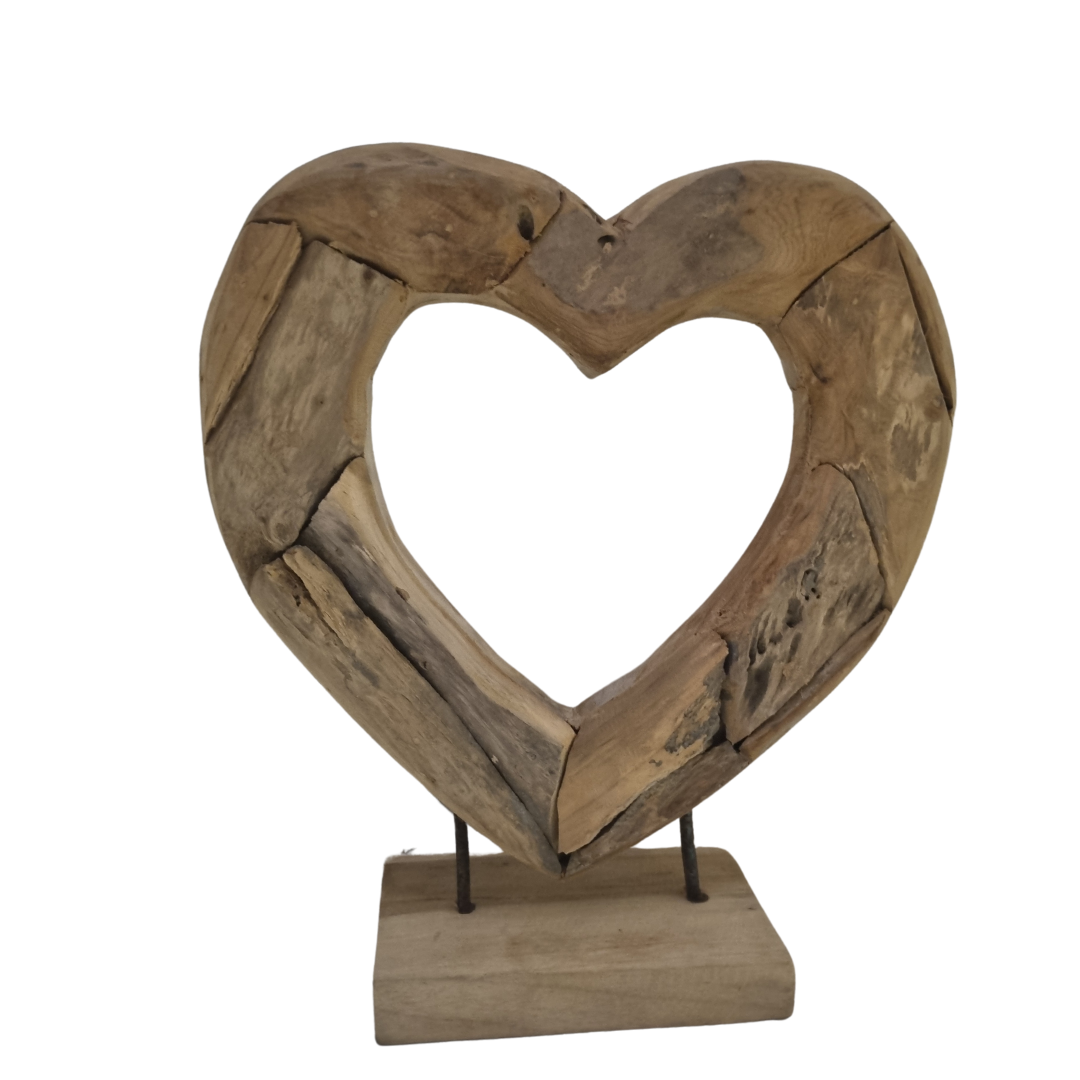 Handcrafted open driftwood heart teak sculpture elevated on twin steel pins above rectangular teak base — natural wood grain detail, 35 x 30cm