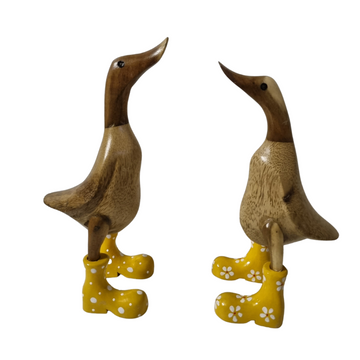Ducks Bamboo Wellington Boots yellow dasiy and spotted boot on white back ground facing each other 