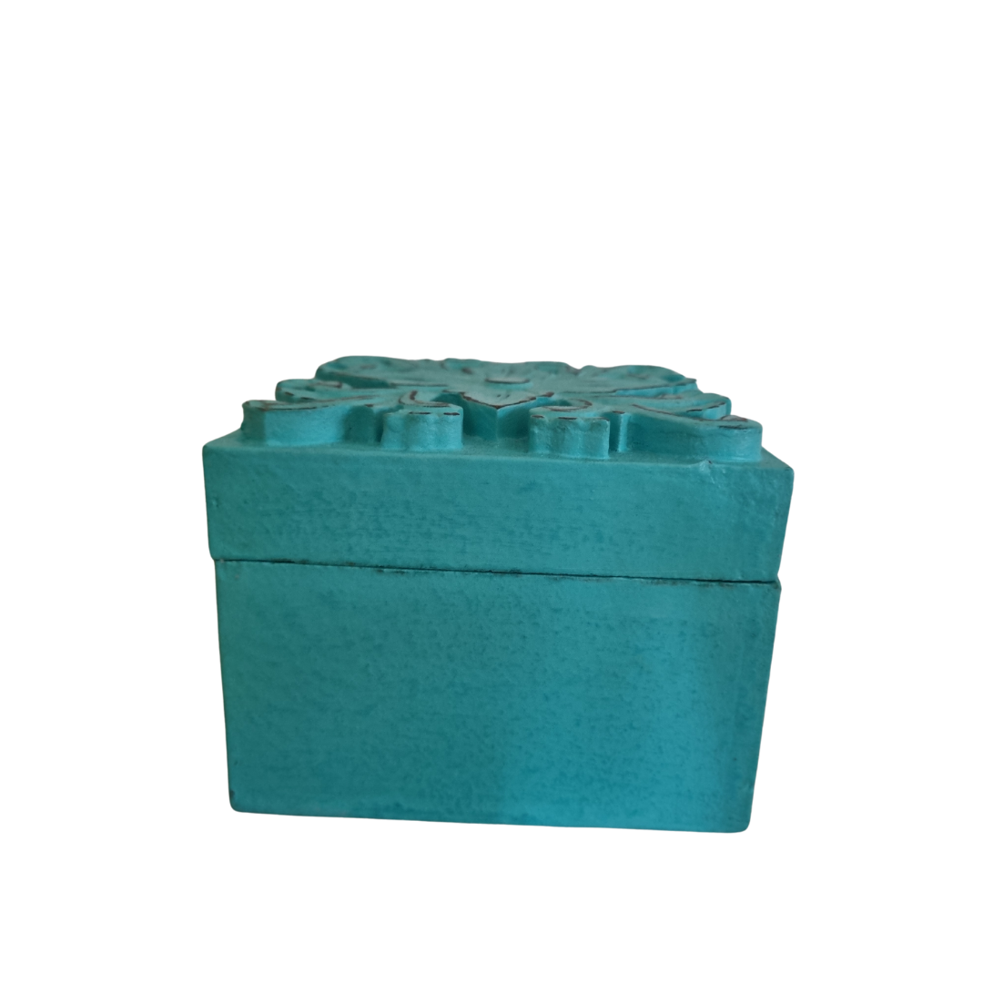 A turquoise Floral Blossom Trinket Box with intricate floral carvings on the lid, side view suitable for storing small trinkets and crystals.