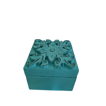 A turquoise Floral Blossom Trinket Box with intricate floral carvings on the lid, suitable for storing small trinkets and crystals.