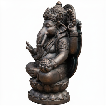 Angled view of a large rustic bronze concrete statue on a white background, showing intricate hand-carved detail