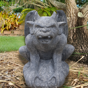 A rustic style gargoyle garden statue made from reinforced concrete and glass fiber, displayed in a natural outdoor setting.