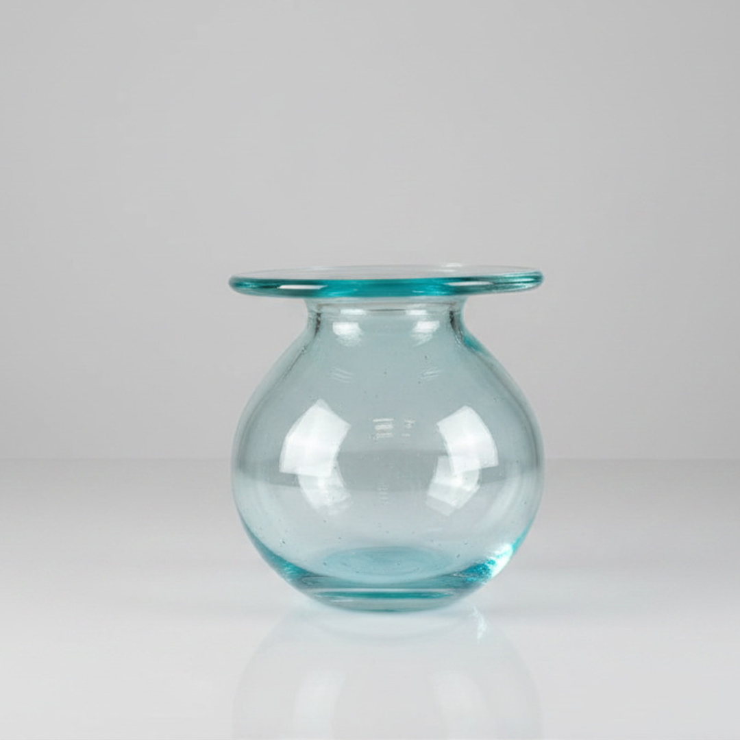 Round tinted vessel with wide flat collar rim, open top view on grey background