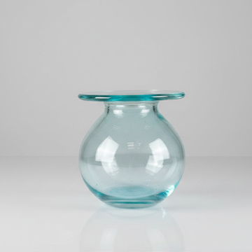 Round tinted vessel with wide flat collar rim, open top view on grey background