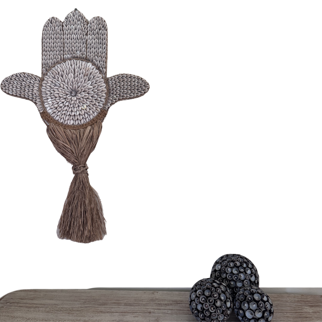Decorative item with a tassel on a wooden surface