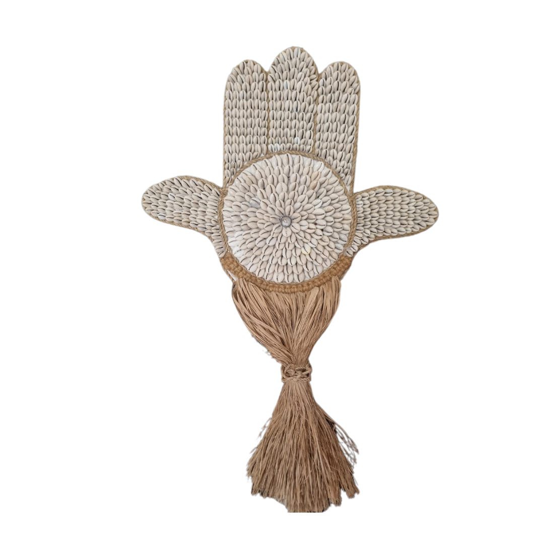 Decorative item resembling a hand with a tassel on a white background