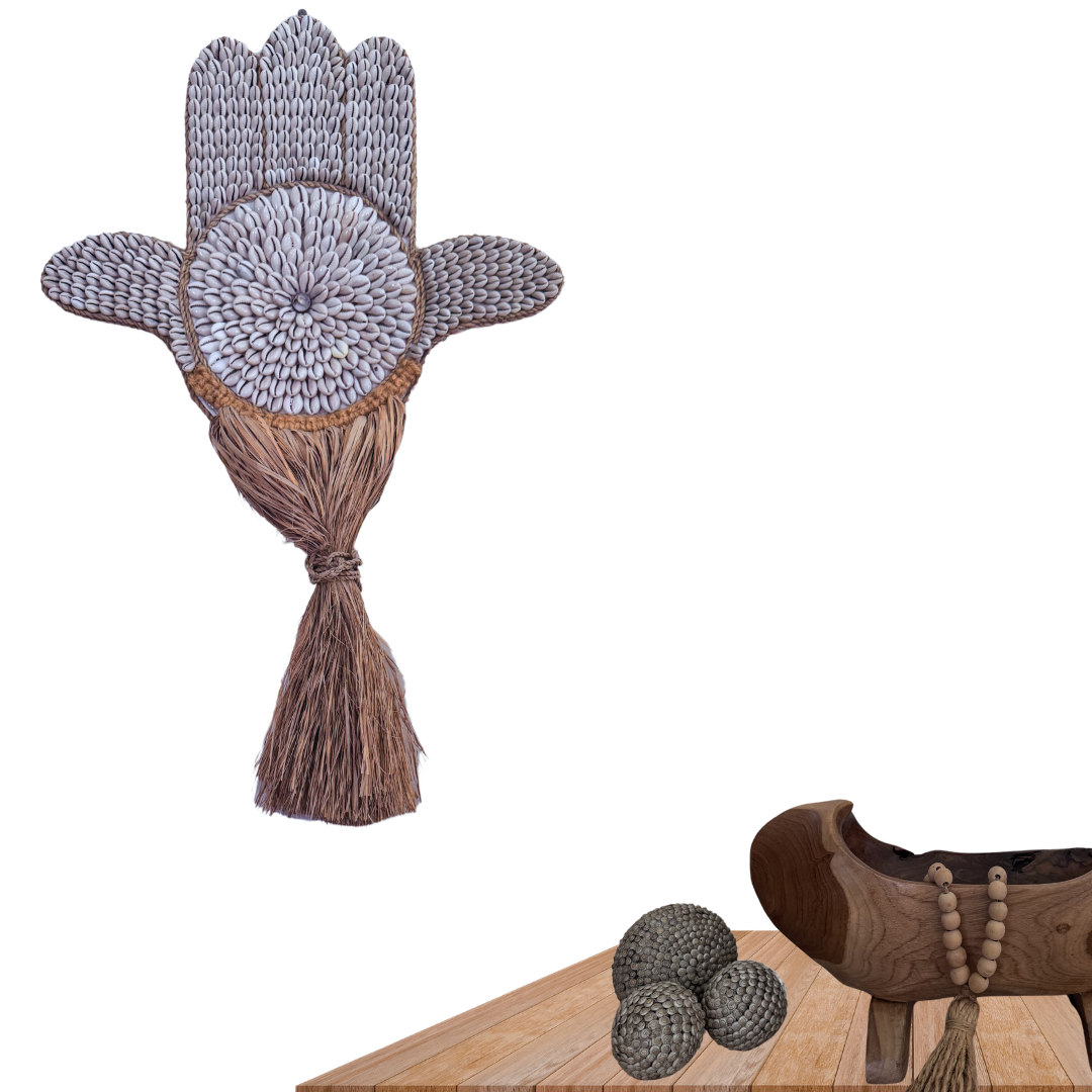 Decorative wall hanging with tassel and wooden clog on a white background